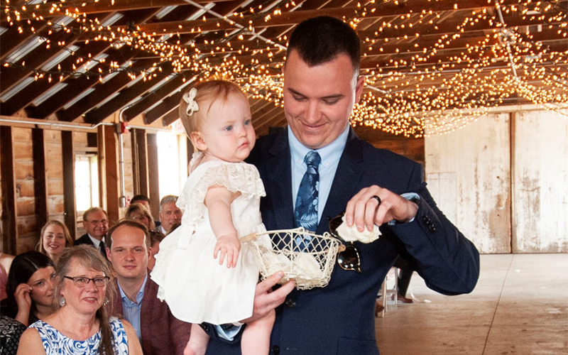 Weddings - Man Holding baby Flower Girl - Image